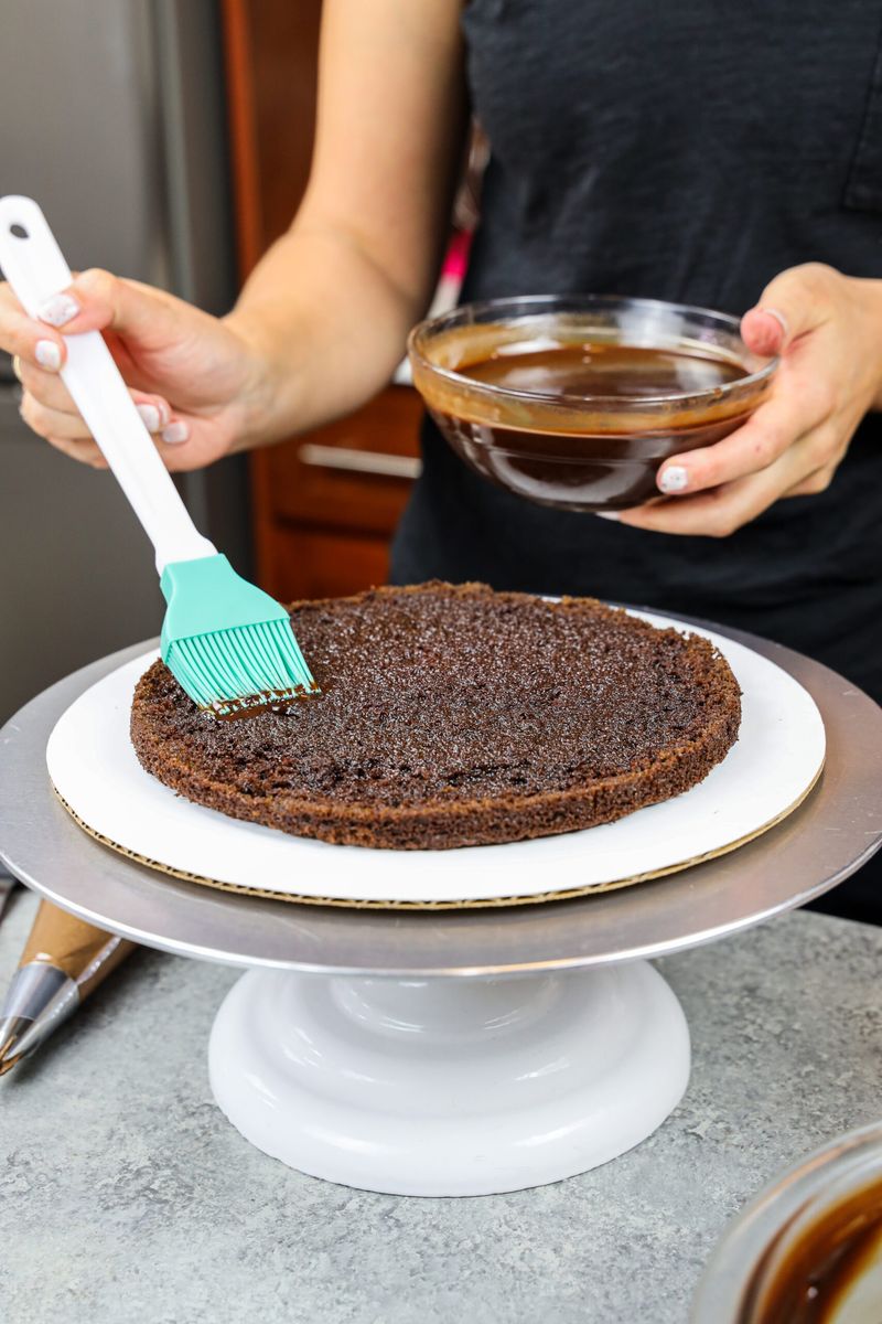 9. Brush the Cake Layers with Syrup or Jam Before Frosting