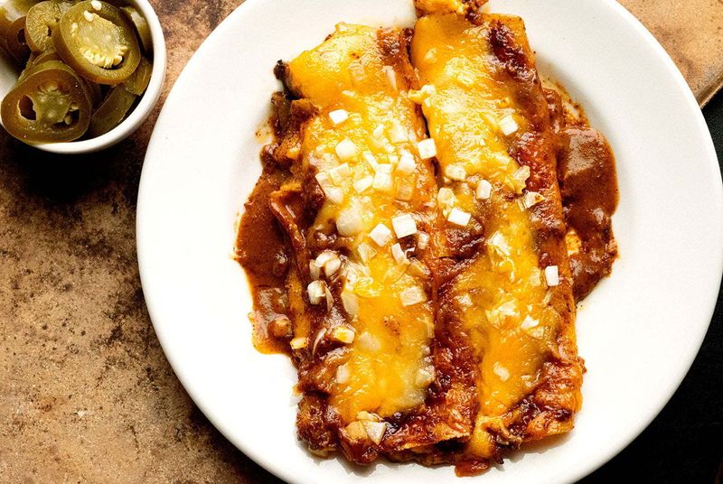 Tex-Mex Enchiladas Drenched in Cheese Sauce