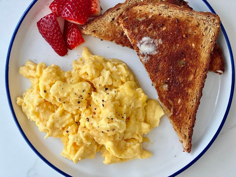 Overcooked Scrambled Eggs and White Toast