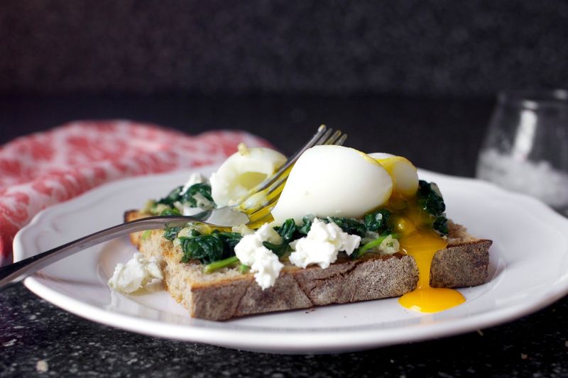 Herbed Ricotta Toast with Sautéed Greens and Eggs