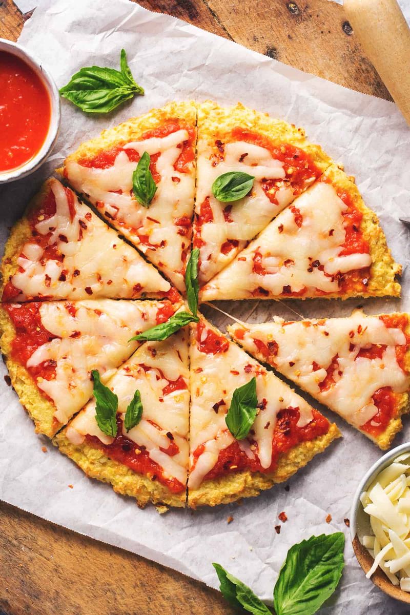 Frozen Cauliflower Pizza Crust + Pizza Sauce + Shredded Cheese