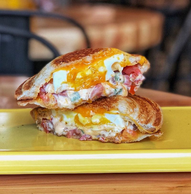 Arizona – Chipotle Bacon, Egg, Ham, and Cheddar on a Toasted Bun