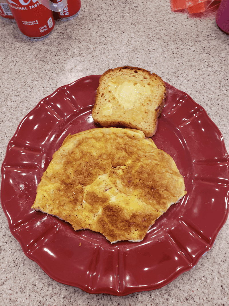 Overcooked Scrambled Eggs and Burnt Toast