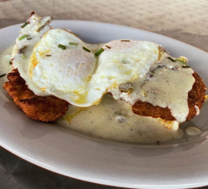 Indiana – Pork Tenderloin, Fried Egg, and Cheese on a Biscuit