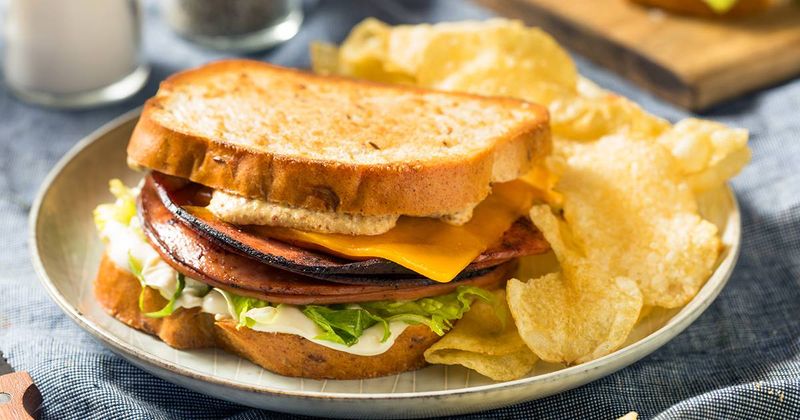 Oklahoma – Buttery Biscuit Sandwich with Eggs, Bologna, and Spicy Jelly