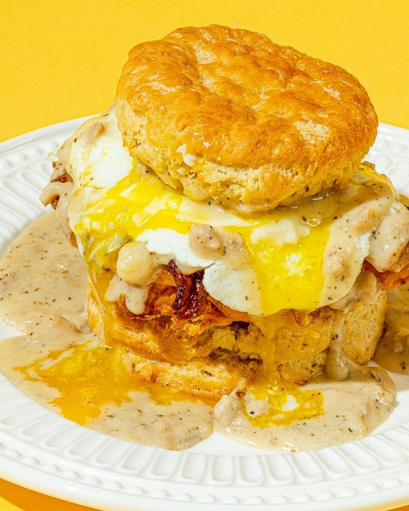 Oregon – Fried Chicken, Bacon, Cheddar, Egg, and Gravy on a Flaky Biscuit