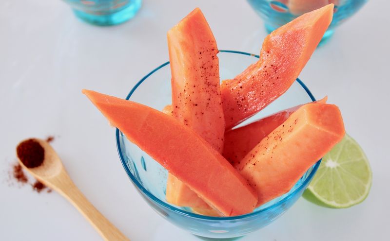 Chilled Ripe Papaya with Lime and Tajín
