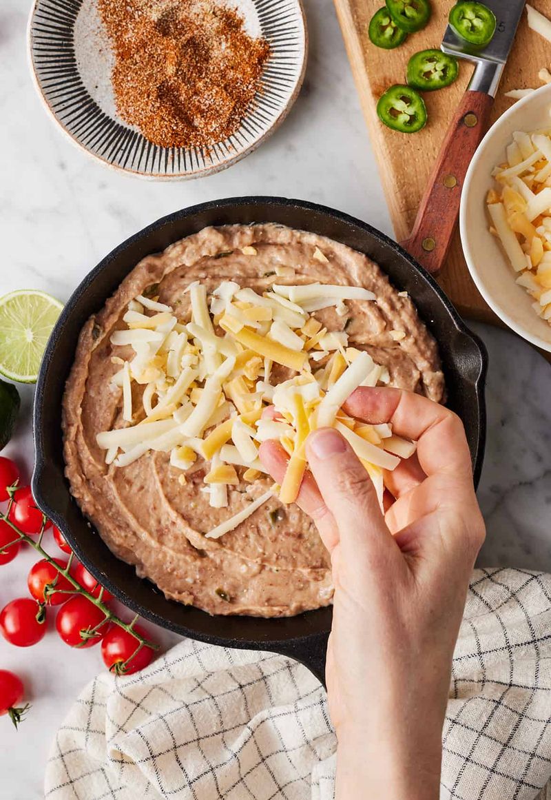 Refried Beans Topped with Melted Cheese