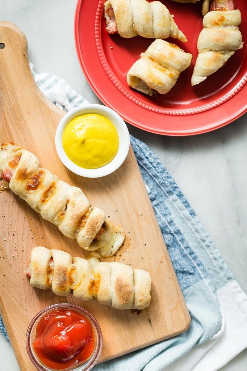 Cheese-Stuffed Hot Dogs Wrapped in Pizza Dough