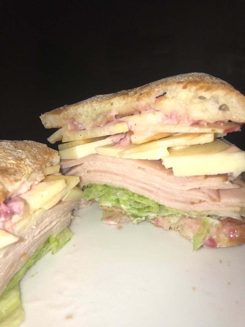 Vermont – Cheddar, Apple Slices, Egg, and Maple Sausage on a Sourdough Roll
