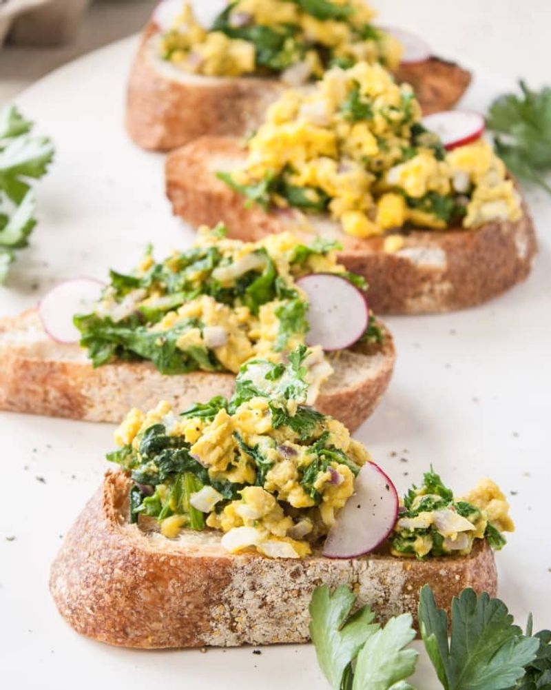 Scrambled Eggs with Sautéed Greens and Toast