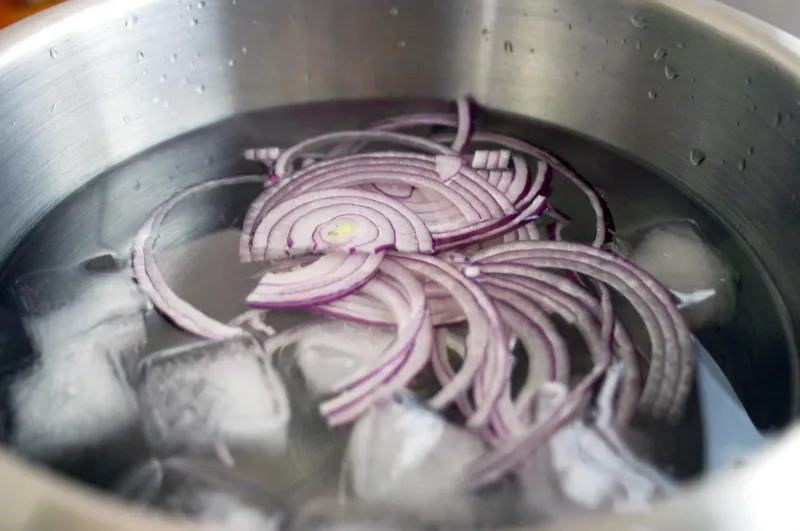 Soak onions in water to mellow their bite