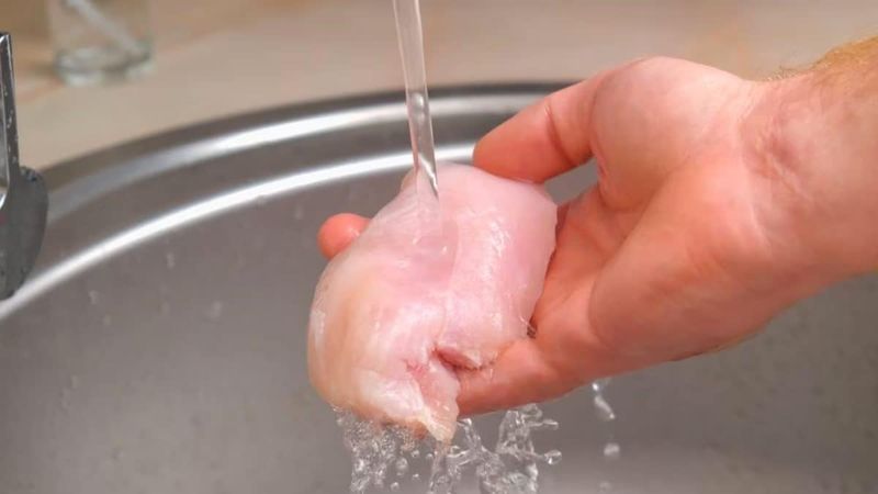 Wash raw chicken