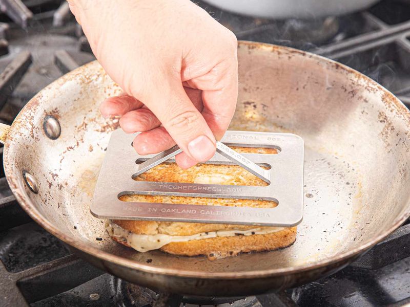 Use a Press or Heavy Skillet to Flatten While Cooking