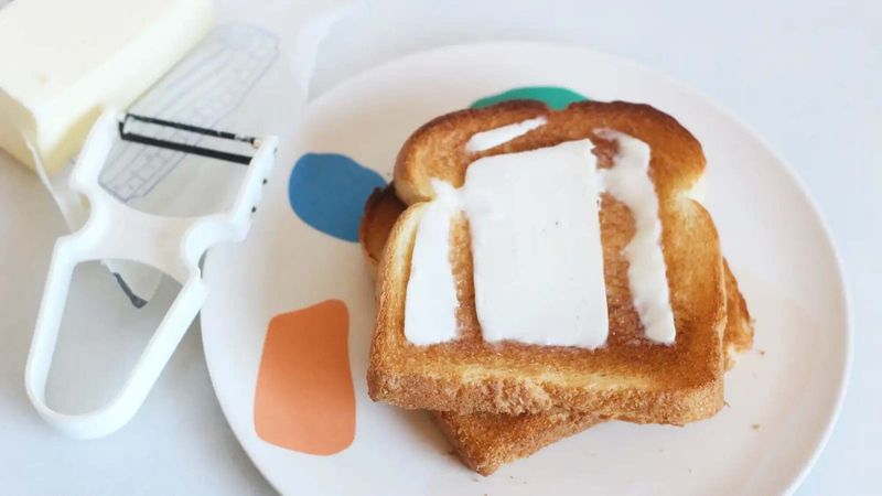 Add cold butter to hot toast